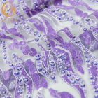 紫色は衣服のために水溶性ハンドメイドのレースの生地の刺繍に玉を付けた