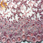 ODMの赤紫のレースの生地はきらめきの装飾が付いている80%のナイロンを刺繍した